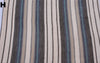 Striped fabric with blue, black, and beige colors.