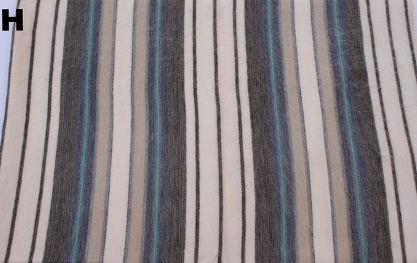 Striped fabric with blue, black, and beige colors.