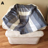 Striped alpaca throw blanket displayed on a couch, styled as a cosy living room cuddle blanket