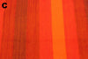 Close-up of red and orange fabric with visible texture