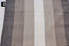 Striped fabric with brown, beige, and white colors on a plain background