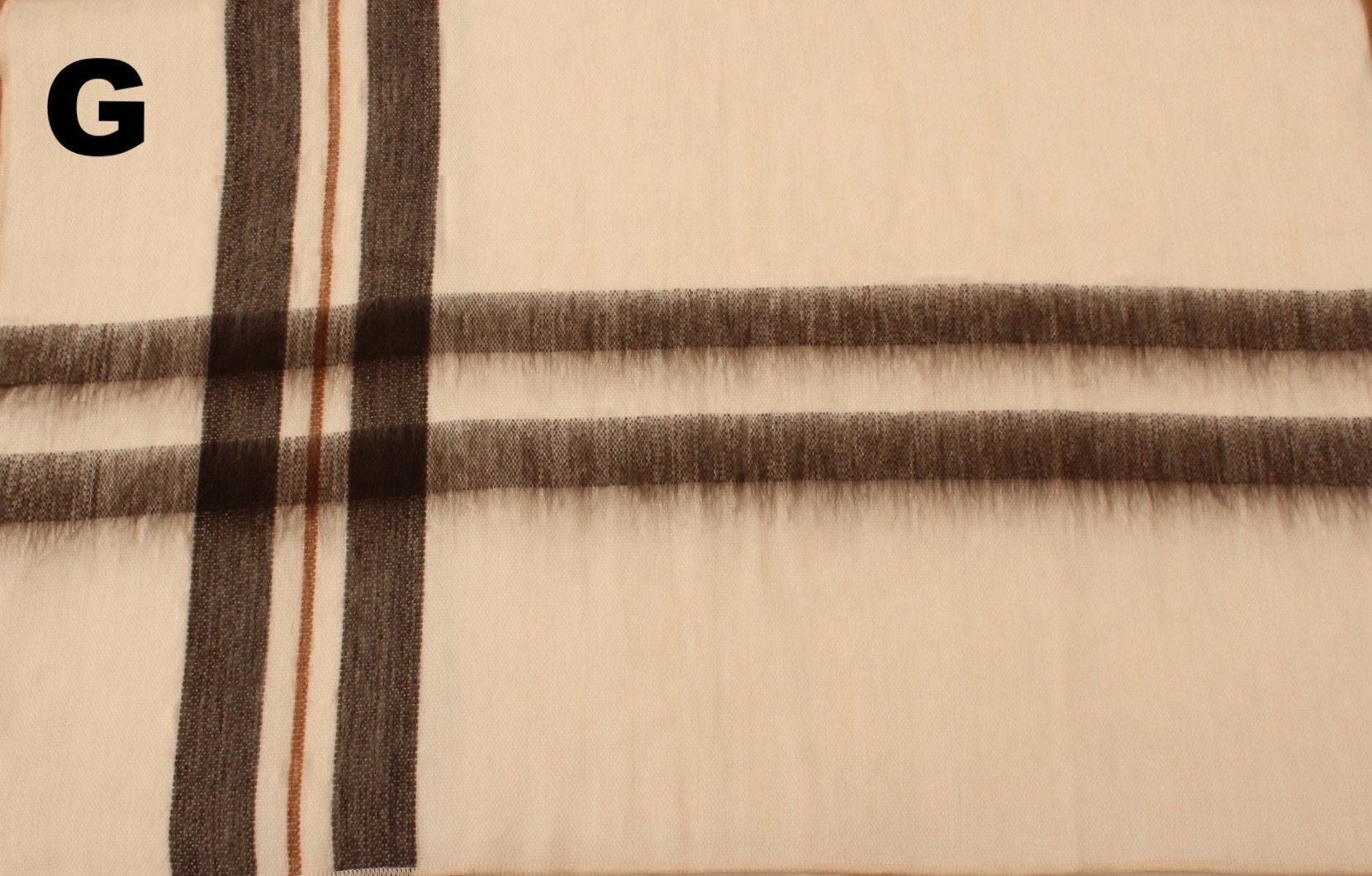 Close-up of a fabric with plaid pattern on a beige background