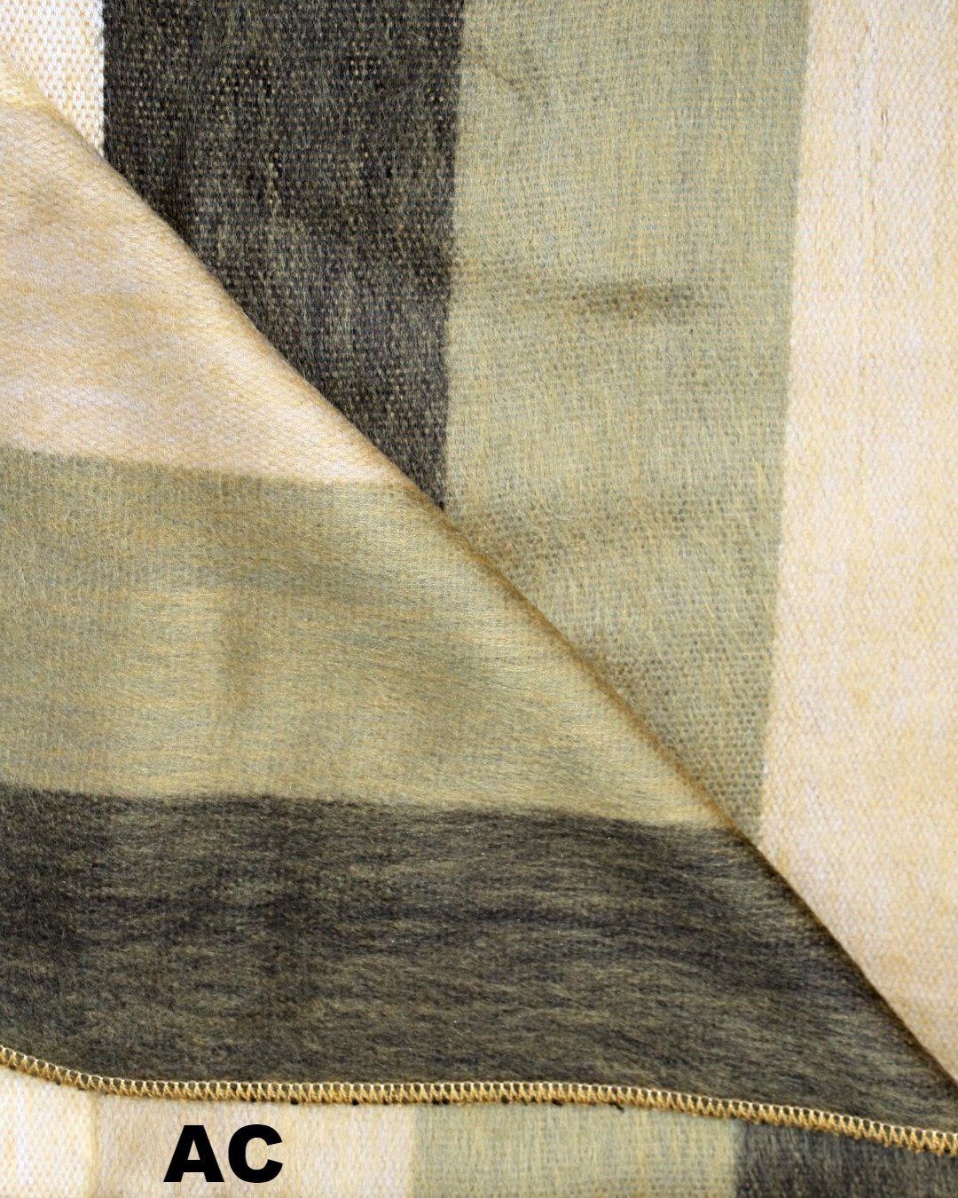 Close-up of fabric with a zipper, showing a pattern of beige, brown, and black.