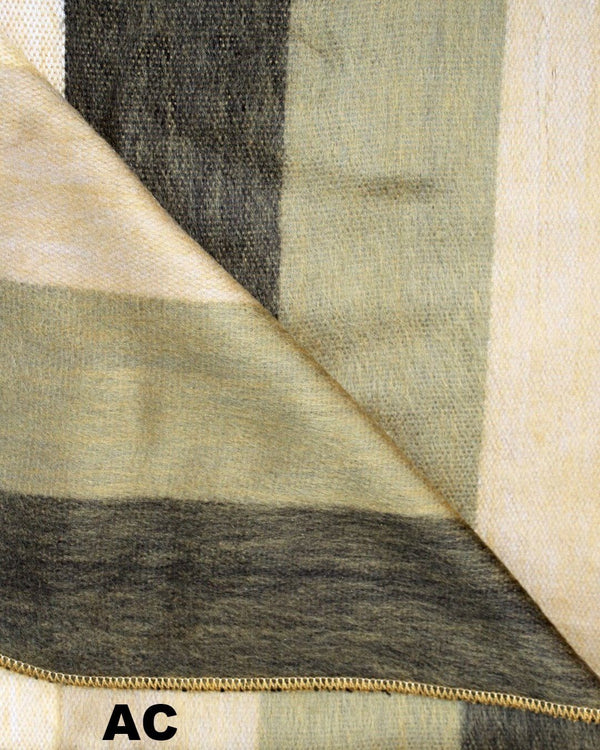 Close-up of fabric with a zipper, showing a pattern of beige, brown, and black.