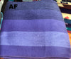 Blue striped towel with 'AF' label on a colorful background