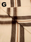 Close-up of plaid fabric with brown and beige colors