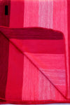 Red fabric with a textured pattern on a white background