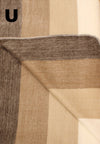 Close-up of a textured fabric with brown and beige pattern