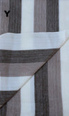Close-up of striped fabric with brown, white, and gray colors.