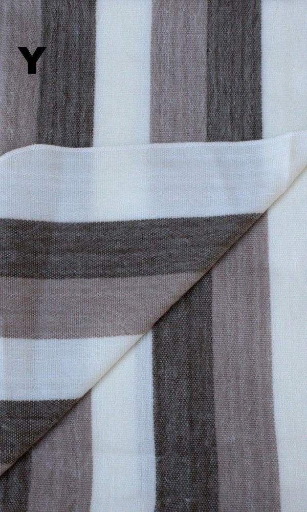 Close-up of striped fabric with brown, white, and gray colors.
