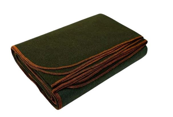 Folded green blanket with brown trim on a white background