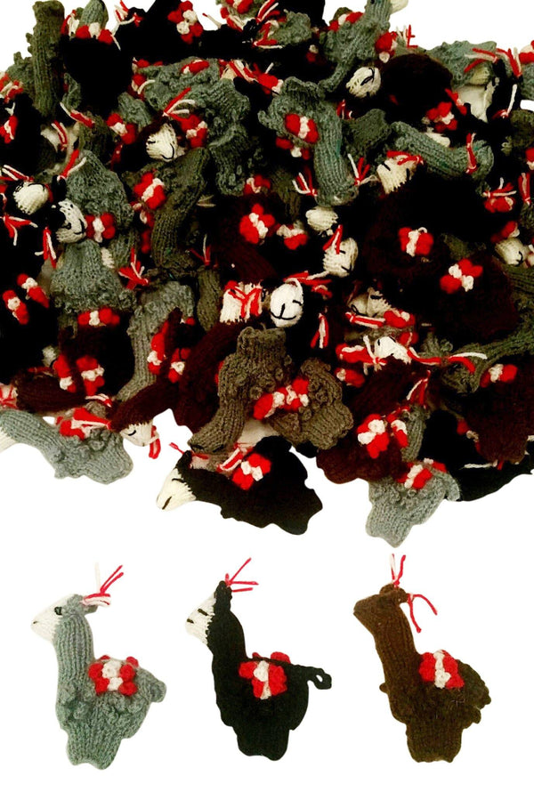 Collection of knitted llama ornaments with red bows on a white background