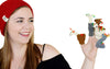 Person wearing a red beanie and holding finger puppets on a white background