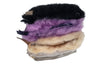 Stack of feathers in black, purple, beige, and gray on a white background