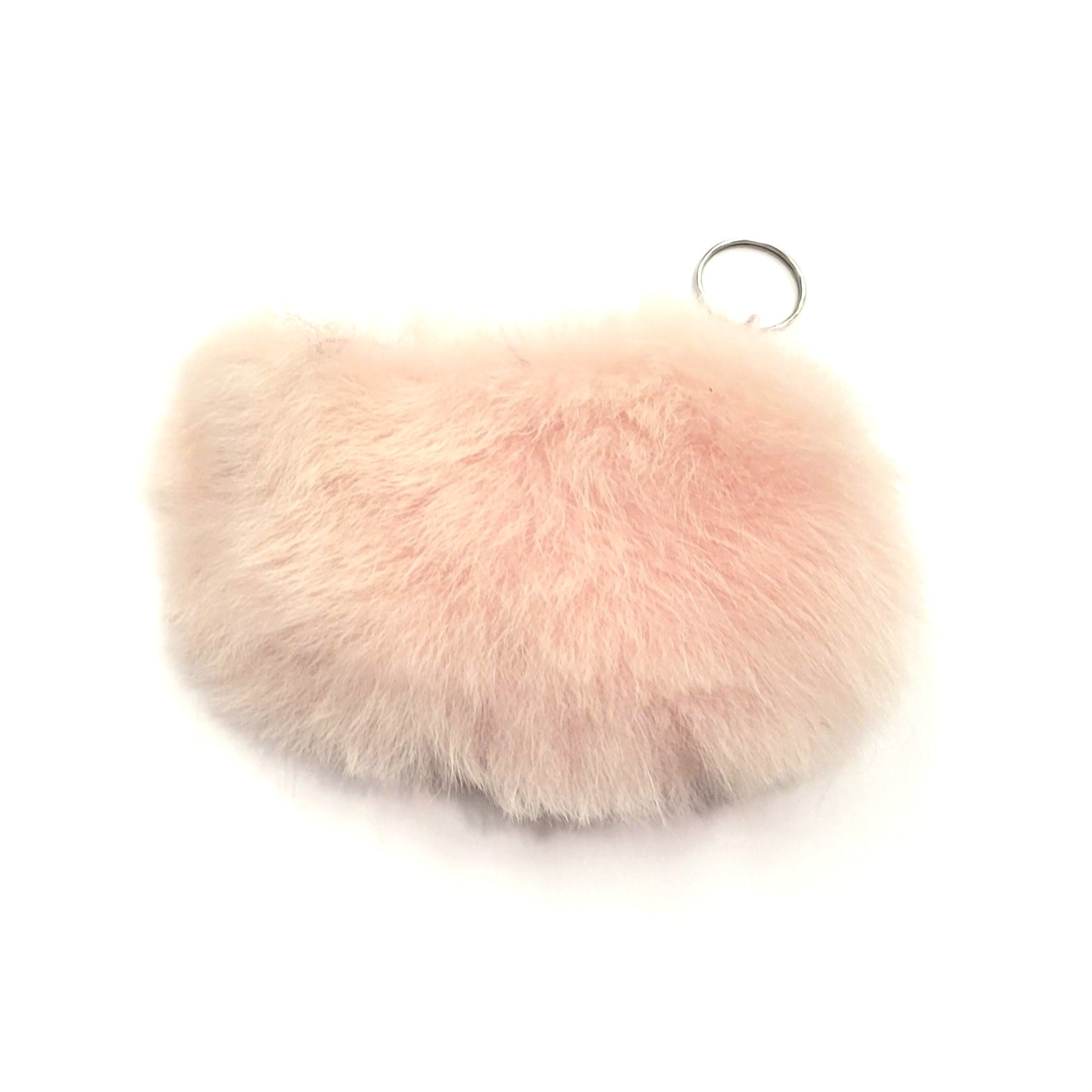 Pink fluffy keychain on a white background