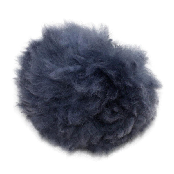 Dark blue fluffy pom-pom on a white background