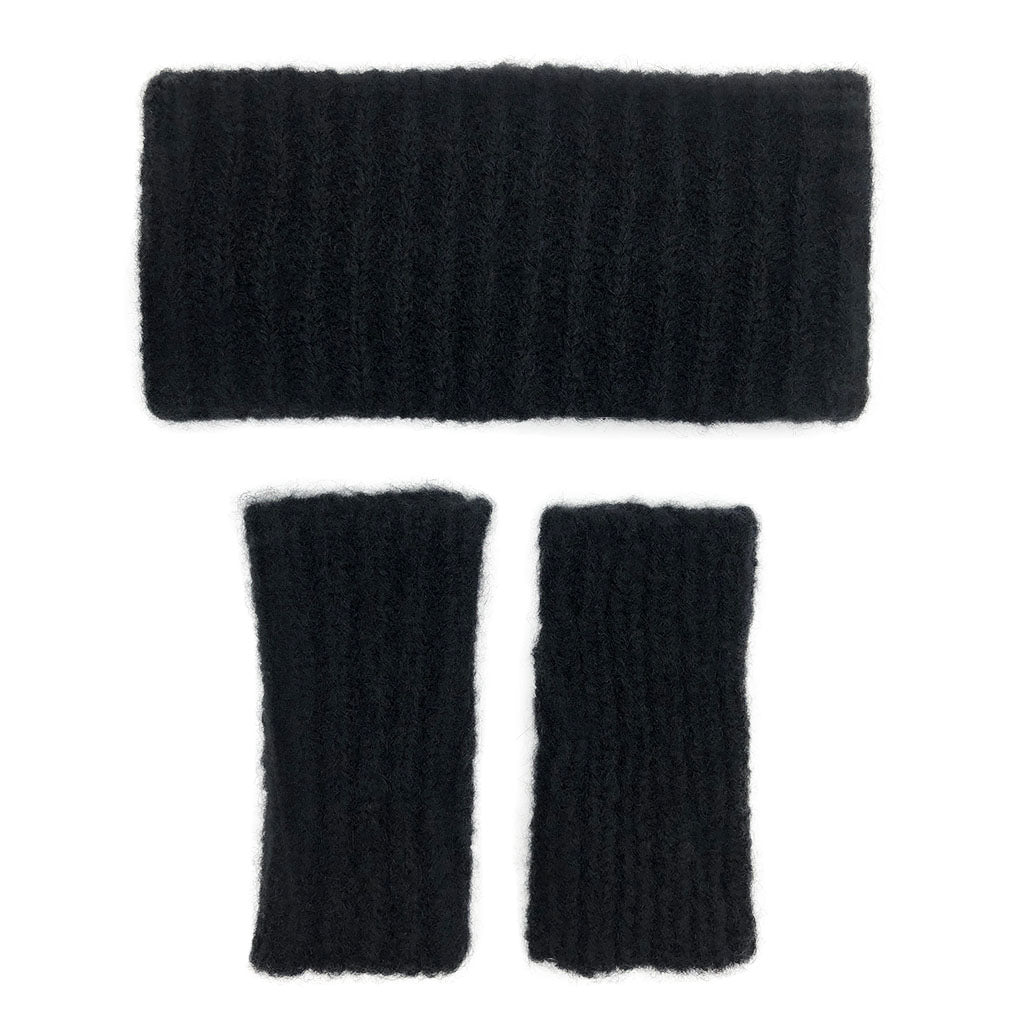 Set of black knitted headband and arm warmers on a white background