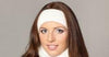 Woman wearing a white headband against a neutral background