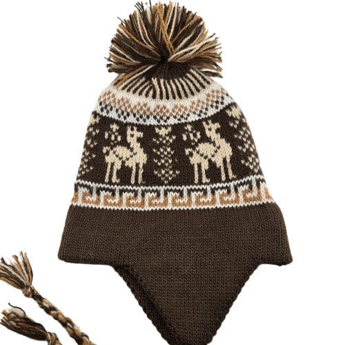 Knitted hat with reindeer pattern and pom-pom on a white background