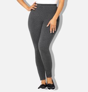 Person wearing gray leggings on a white background