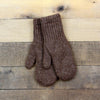 Pair of brown knitted mittens on a wooden surface