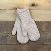 Pair of gray knit mittens on a wooden surface