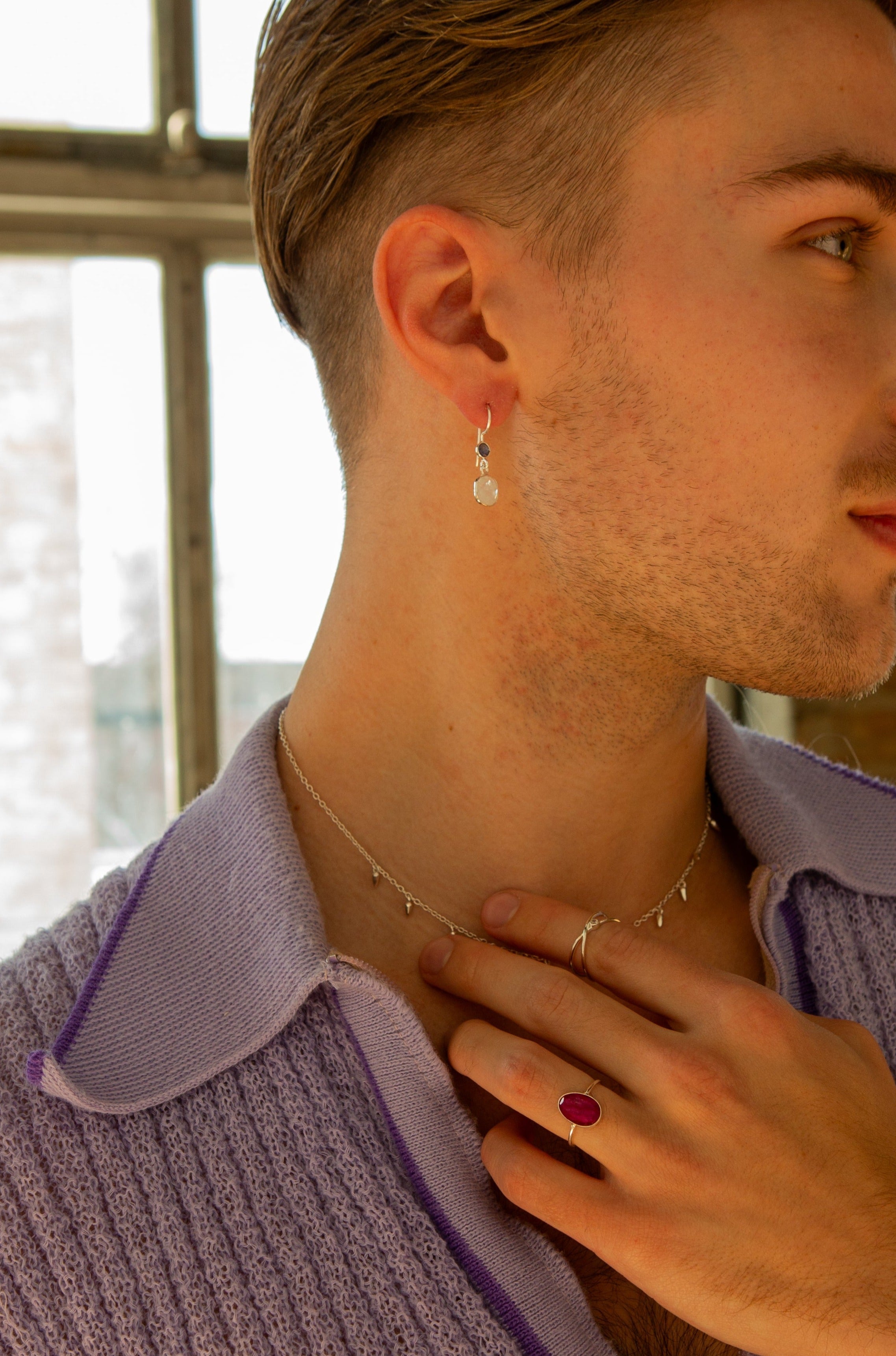 Fair Anita Orbit Sterling Silver Ring styled with other jewellery pieces including earrings and a spike charm necklace