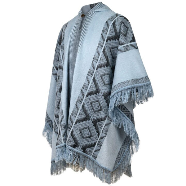 Blue patterned poncho with fringes on a white background