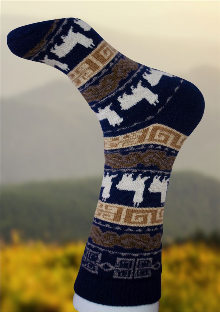 Knitted sock with geometric pattern on a blurred natural background