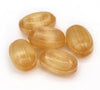 Five light brown wooden beads on a white background