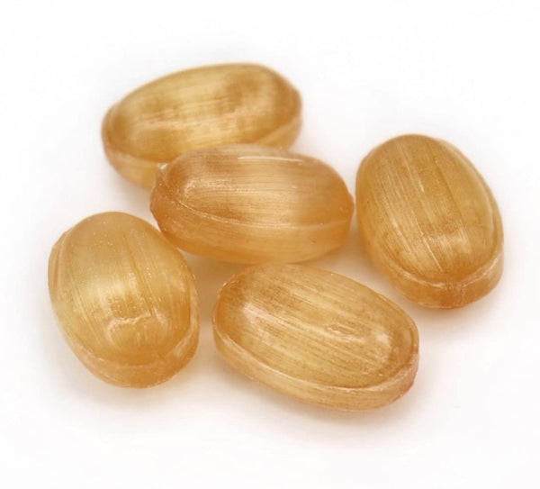 Five light brown wooden beads on a white background