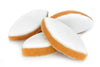 Three sandwich cookies with white frosting and orange cookie base on a white background