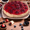 Close-up of fresh strawberry topping on Andy Anand gluten-free sugar-free cheesecake — no syrup, real fruit