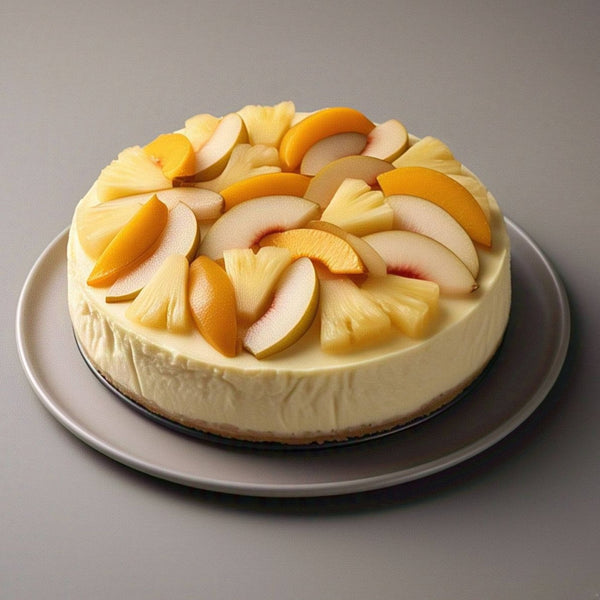 Whole sugar-free tropical fruit cheesecake with vibrant real fruit topping — mango, pineapple, and exotic fruits on a cream cheese base