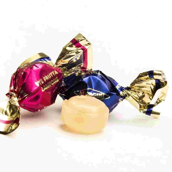 Colorful wrapped candies on a white background
