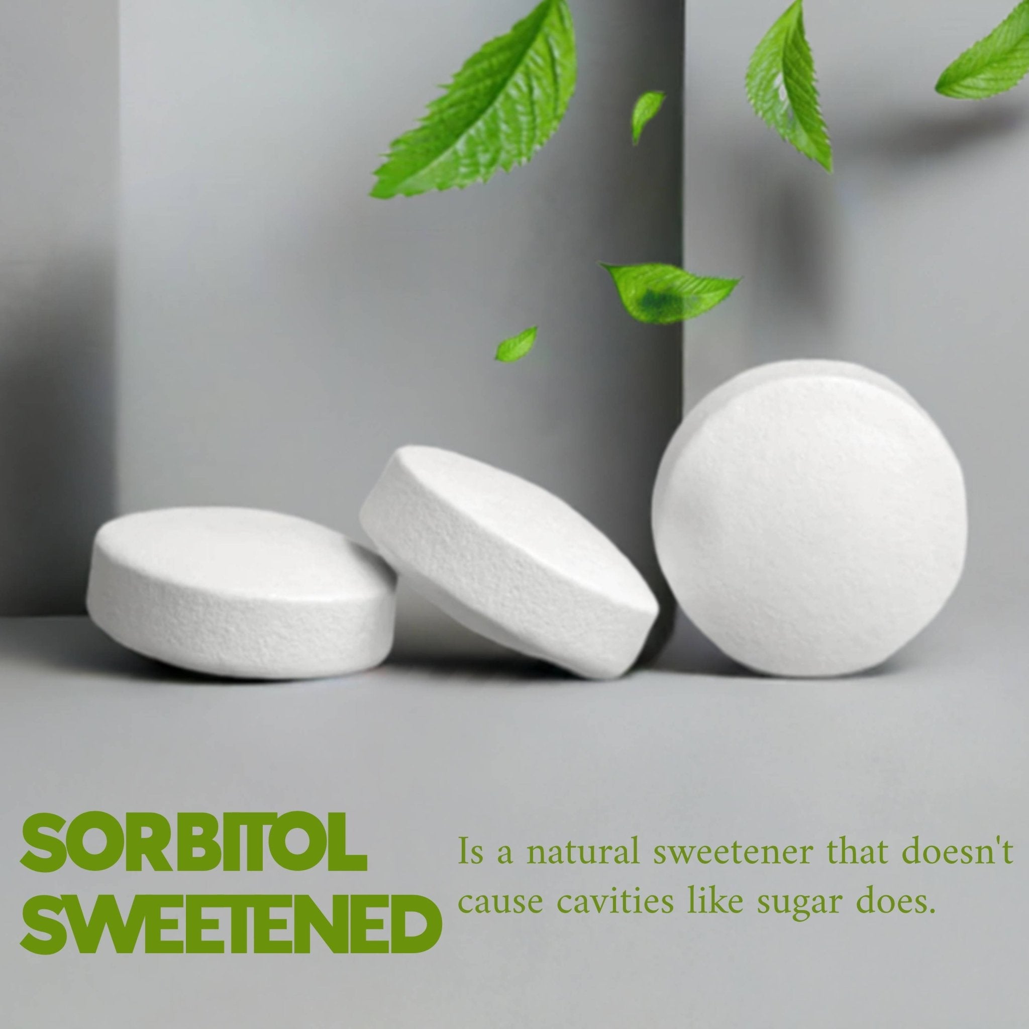 White tablets with green leaves on a gray background, promoting sorbitol as a natural sweetener.