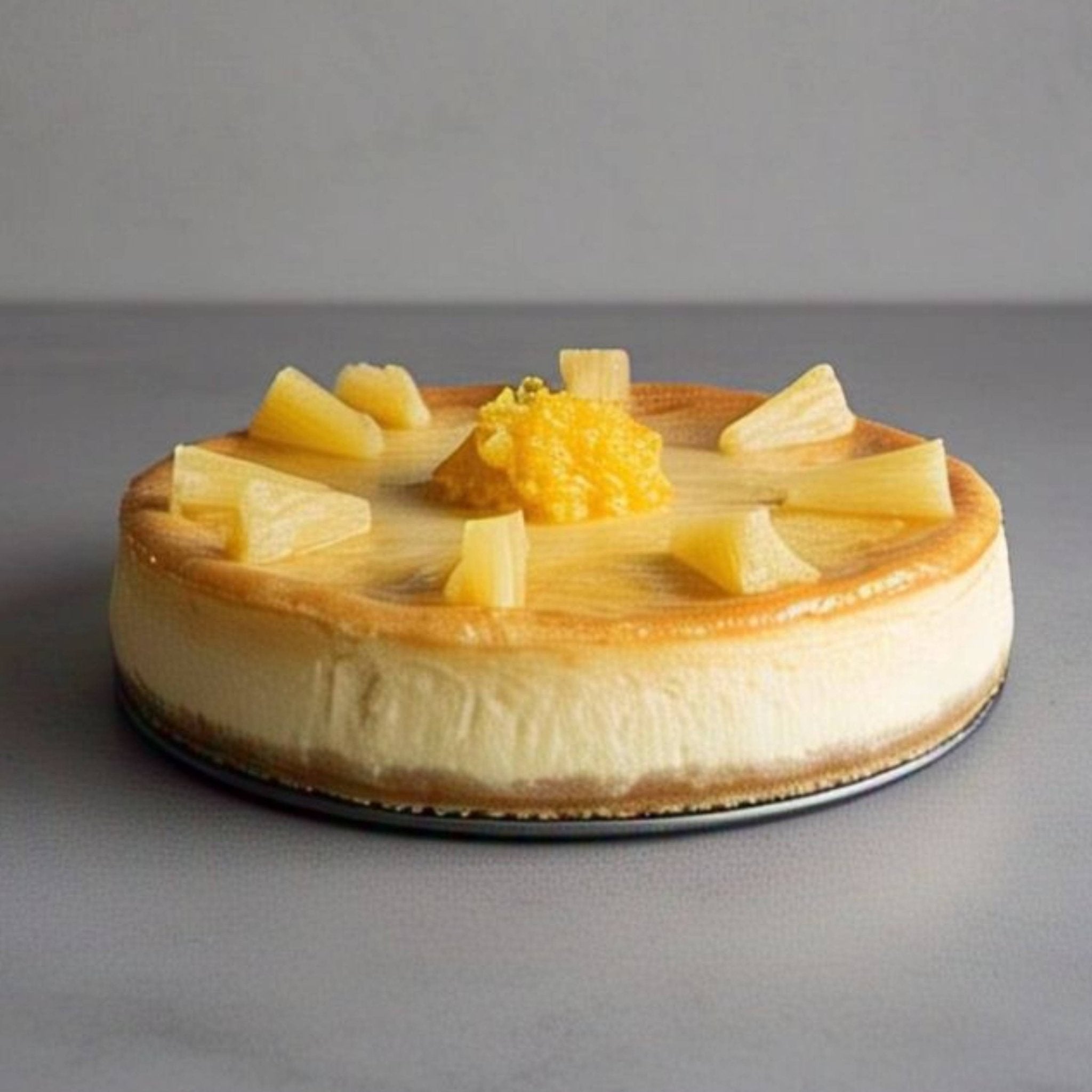 Andy Anand sugar-free pineapple cheesecake slice showing creamy New York-style cream cheese filling with pineapple