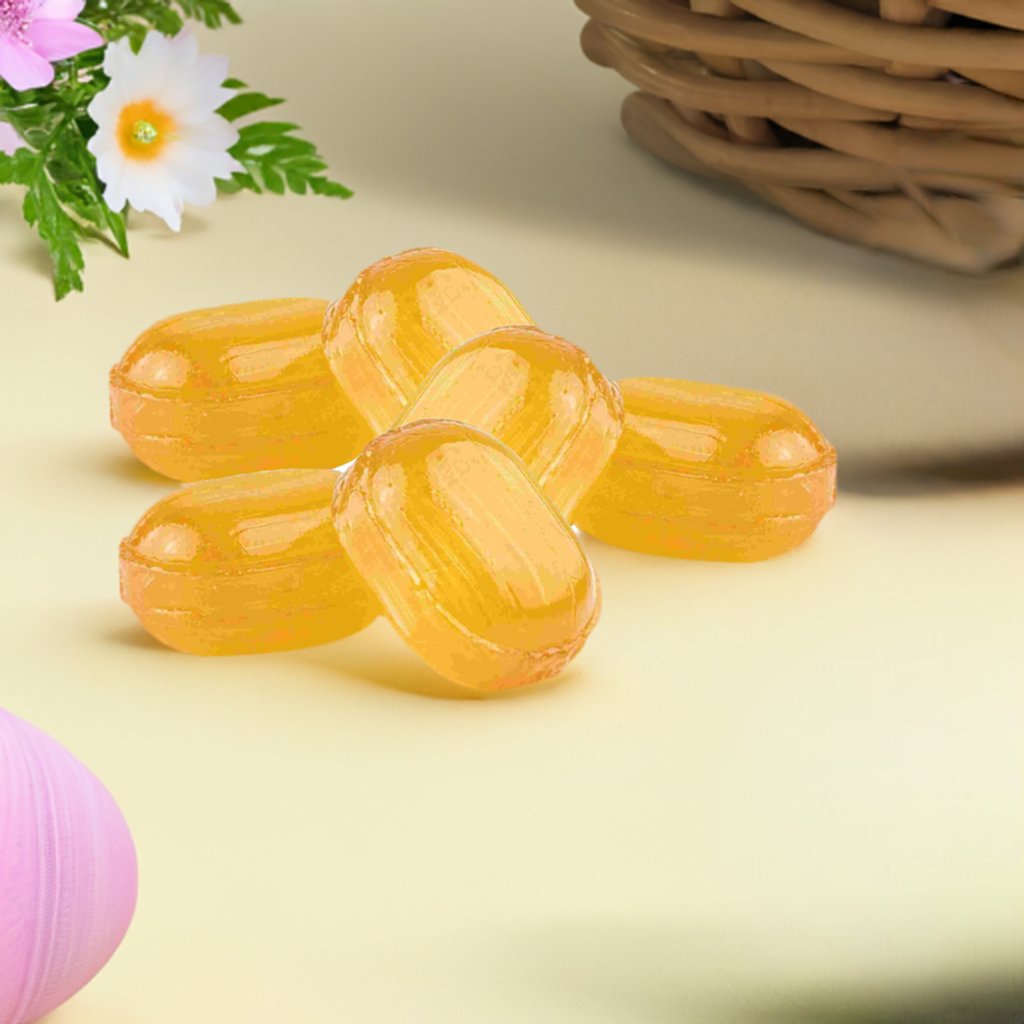 Individually wrapped Andy Anand lemon balm royal jelly hard candies poured from a 7 oz bag