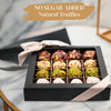 Close-up of no-sugar-added natural date truffles rolled in pistachio, hazelnut, and coconut in a gift box