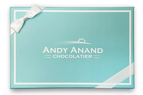 Blue gift box with white ribbon and 'Andy Anand Chocolatier' logo