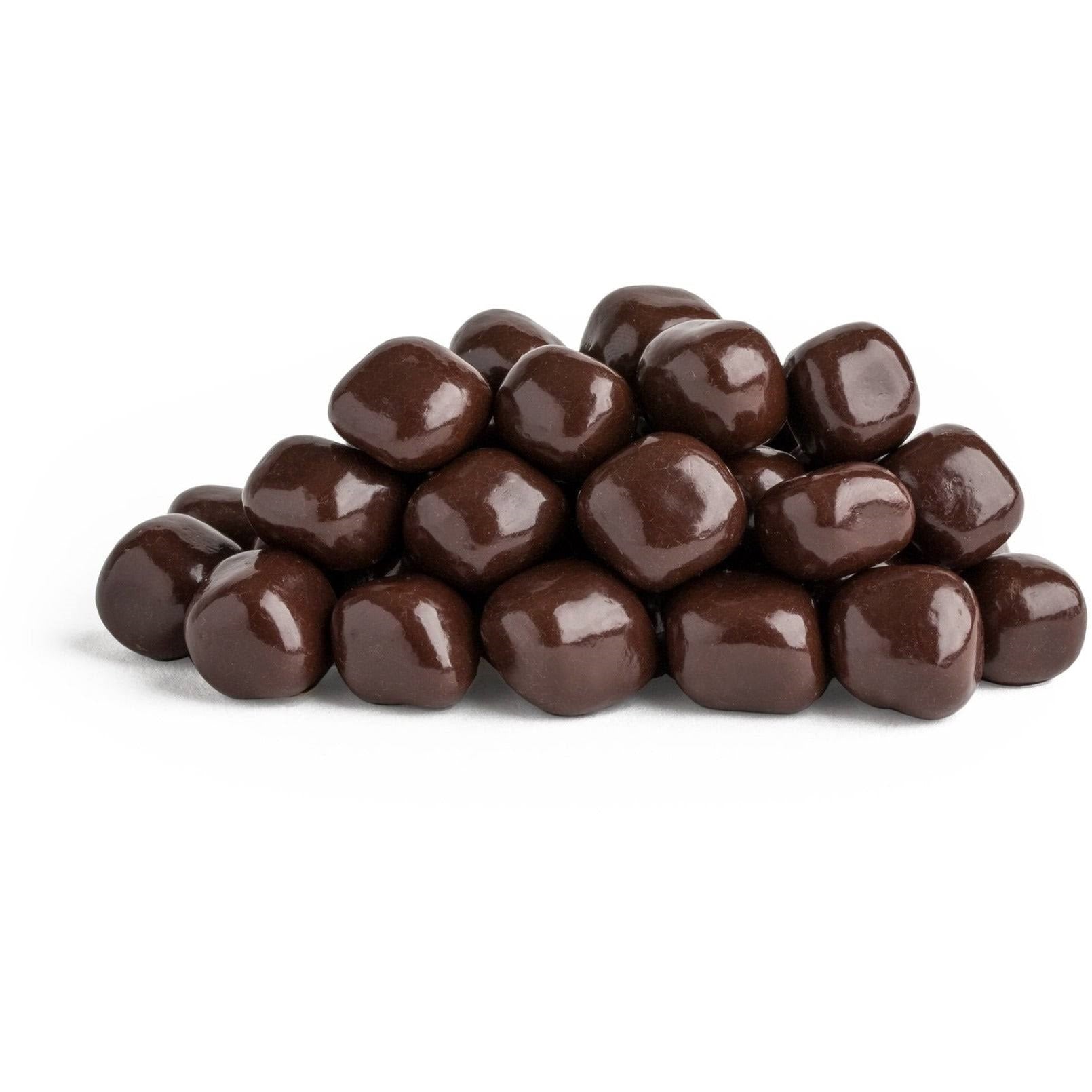 Pile of chocolate-covered candies on a white background