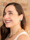 Green onyx encaged stud earrings styled on model, ethically made in India by Fair Anita
