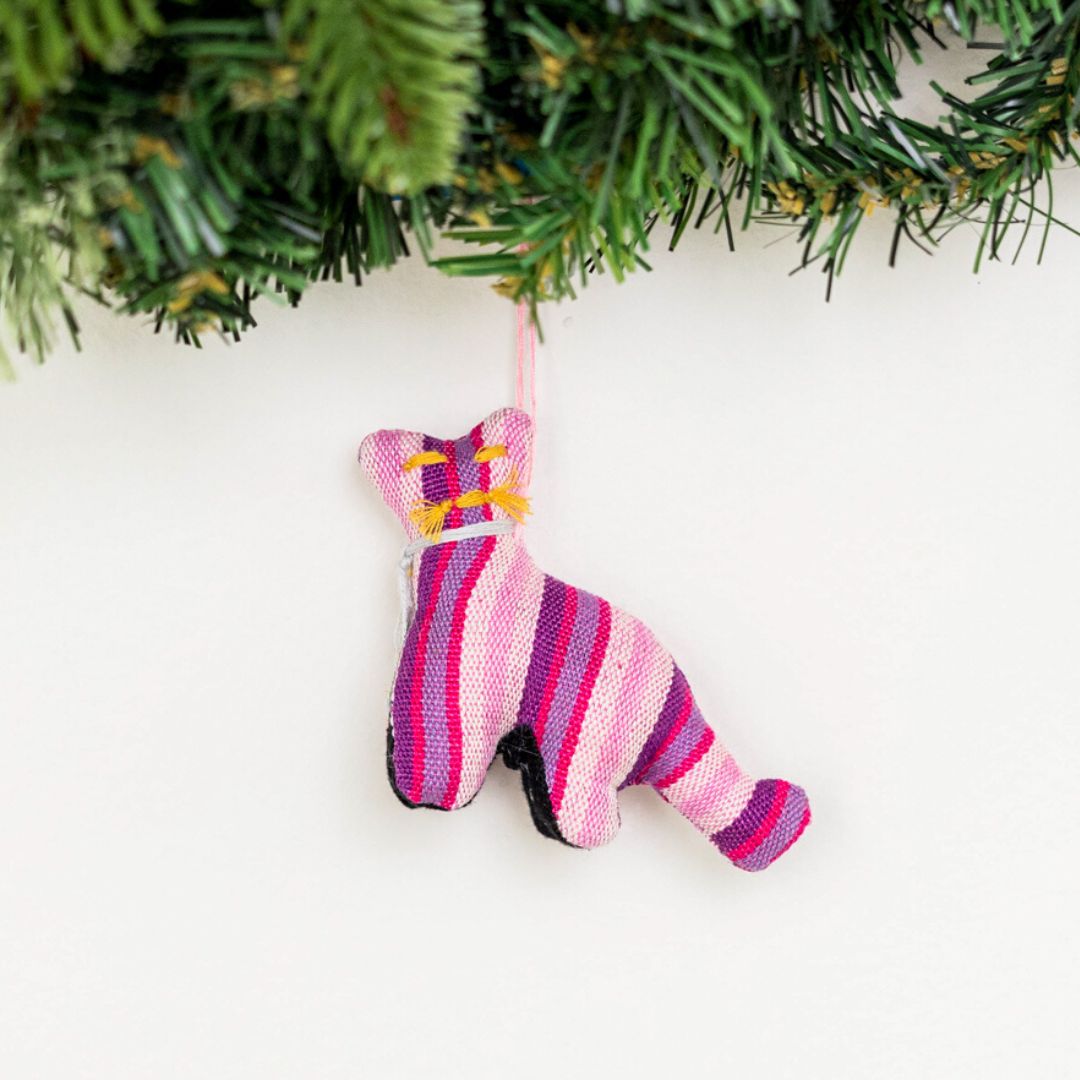 Add a touch of whimsy to your home with our adorable Animalitos. These handcrafted decorations are made from sustainable cotton and support fair trade practices.