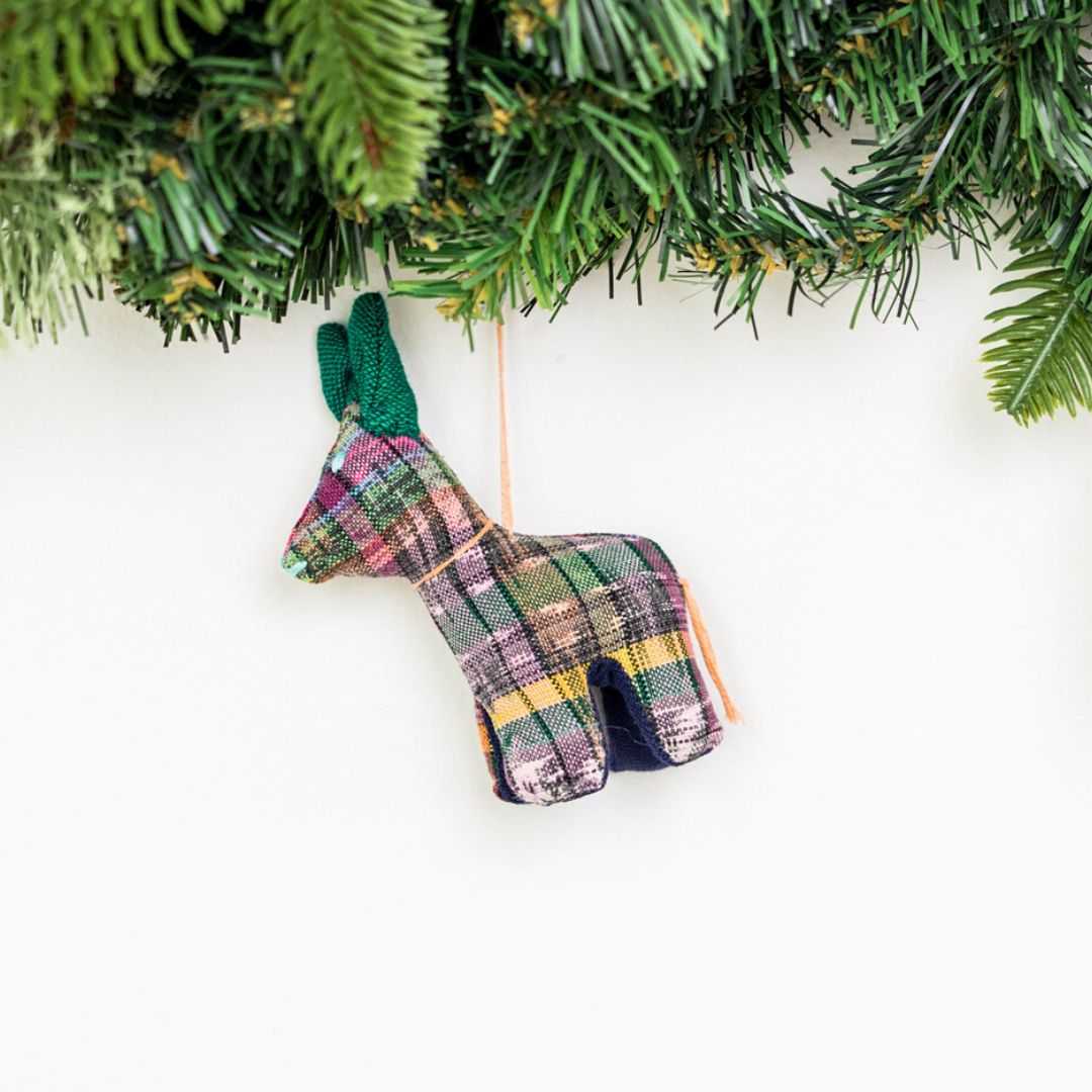 Add a touch of whimsy to your home with our adorable Animalitos. These handcrafted decorations are made from sustainable cotton and support fair trade practices.