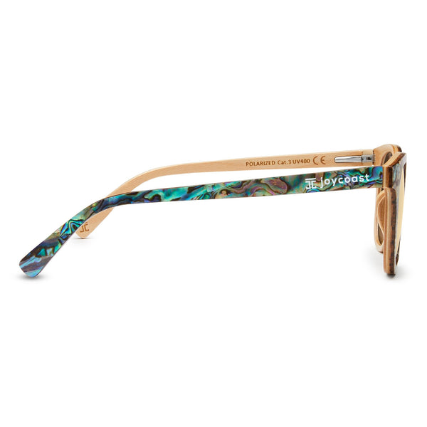 Sunglasses with a colorful frame and wooden accents on a white background