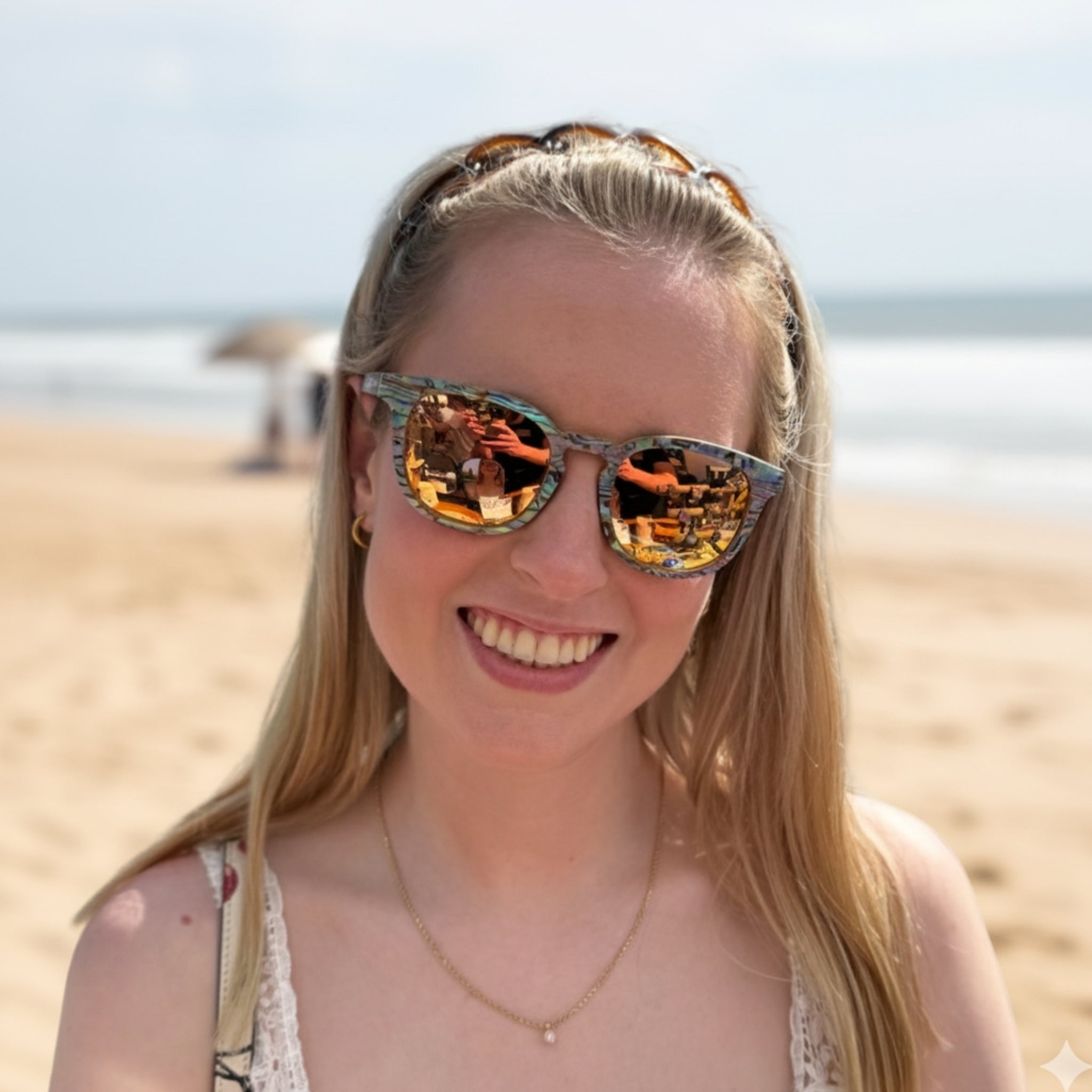 AquaWave wooden sunglasses with rose gold polarized lenses and abalone shell accents