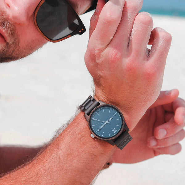 Atlantic Northstar wooden watch by Joycoast — dark sandalwood and blue face flat lay