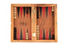 Wooden backgammon set with pieces and dice on a white background