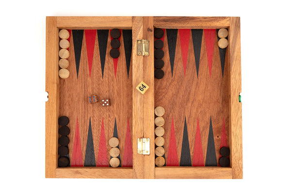 Wooden backgammon set with pieces and dice on a white background