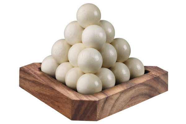 Wooden bowl with a pyramid of white spherical objects on a white background